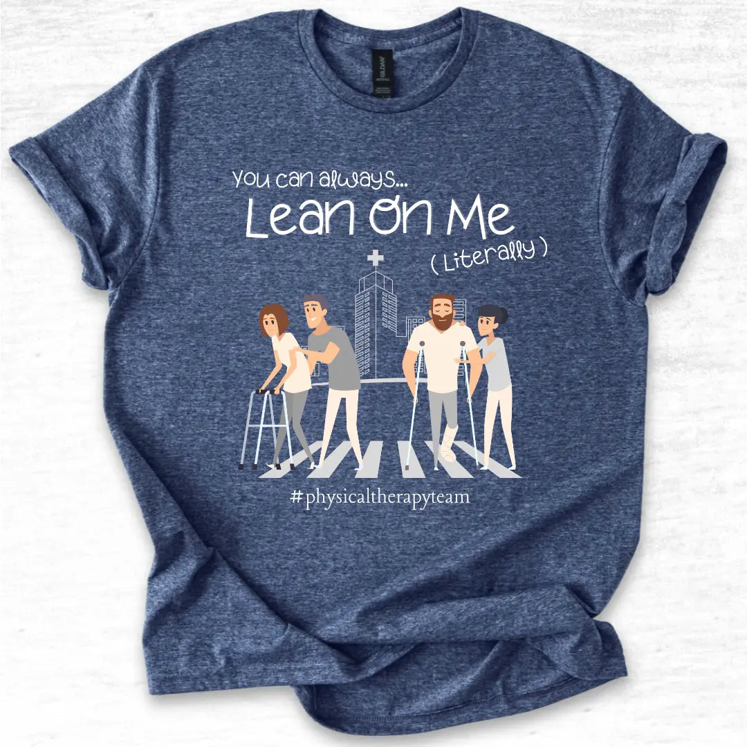 Blue physical therapy t-shirt with graphic design and 'Lean on me, literally' text on a light gray background