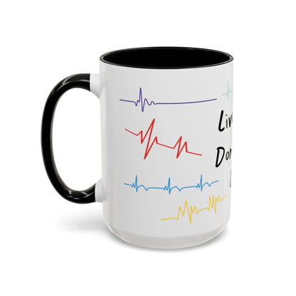 White mug with black handle featuring colorful heartbeat designs on a white background