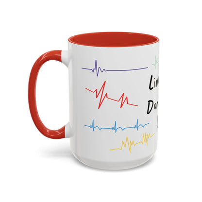 White mug with red interior and handle, featuring colorful heartbeat designs and text on a white background.
