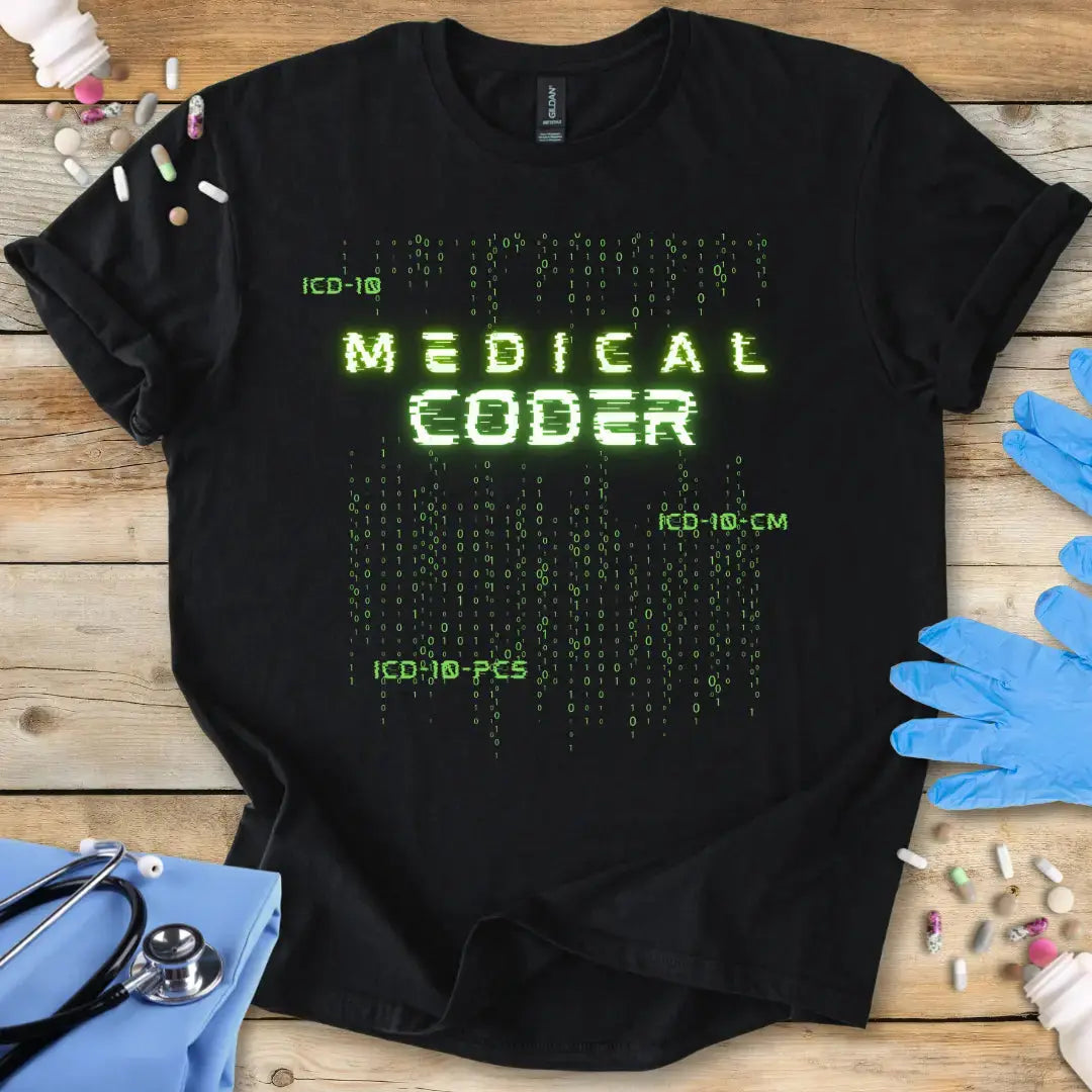 Black t-shirt with 'Medical Coder' text on a wooden surface with medical items.