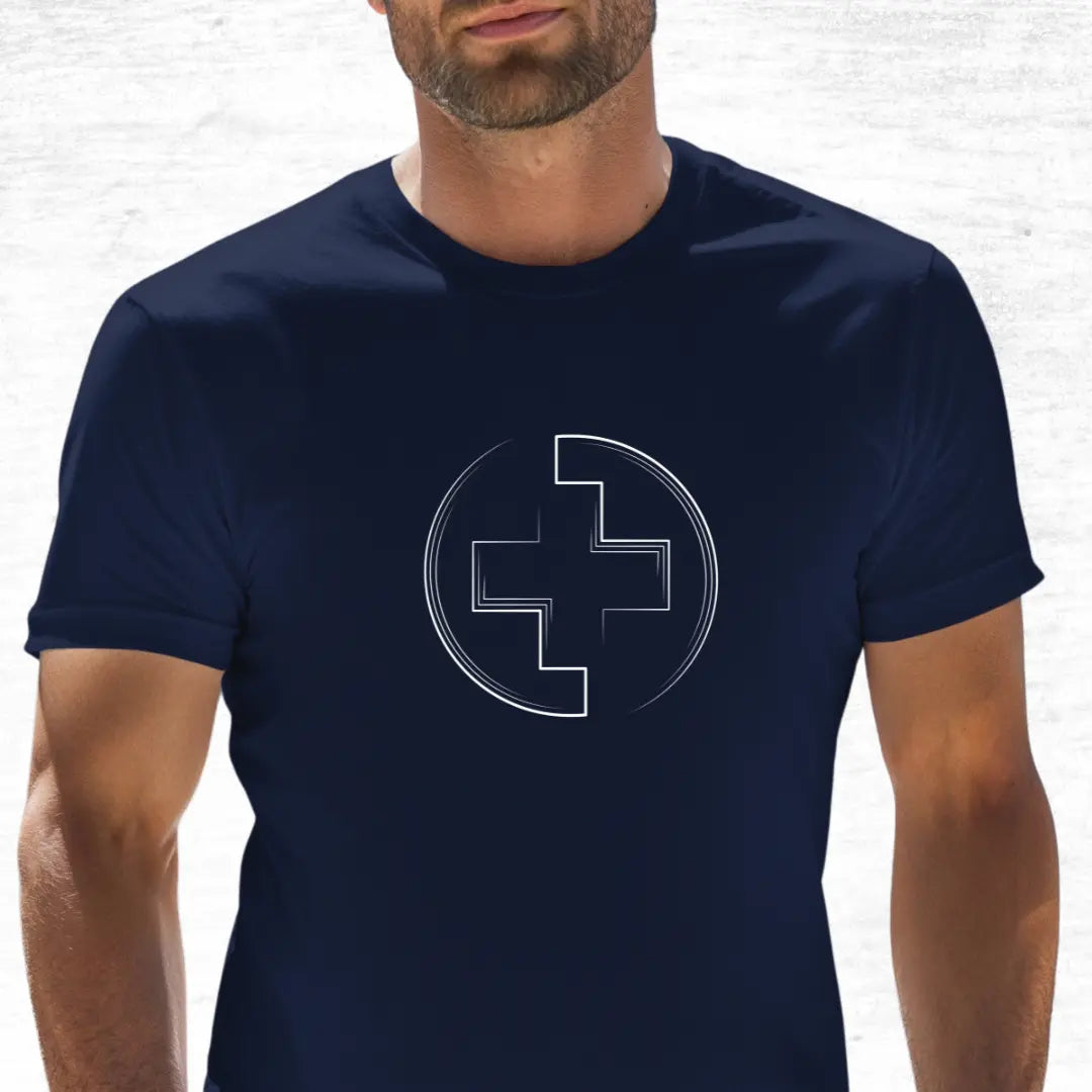 Man wearing a navy blue t-shirt with a white medical cross design on a white background
