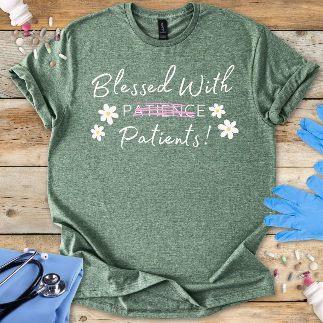 Green medical themed t-shirt with 'Blessed With Patience Patients' text on a wooden surface with medical accessories.