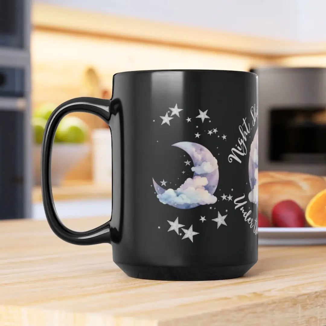 Black mug with moon logo on a kitchen counter