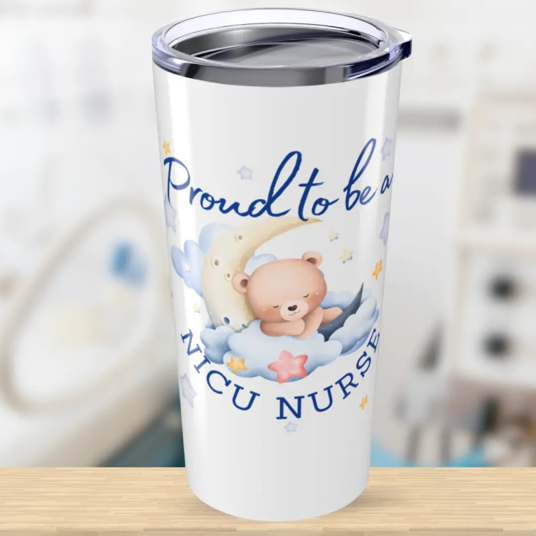 Tumbler with teddy bear design and text 'Proud to be a NICU Nurse' on a blurred background