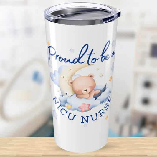 Tumbler with teddy bear design and text 'Proud to be a NICU Nurse' on a blurred background