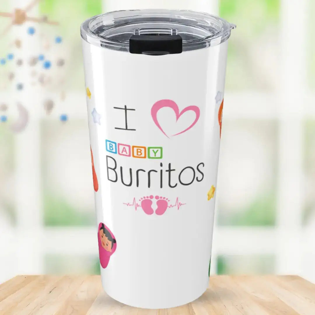 White stainless steel tumbler with 'I ♥ Baby Burritos' text featuring colorful block-letter 'BABY' and pink baby footprint heartbeat design, surrounded by diverse swaddled newborn illustrations, on a blurred nursery background.