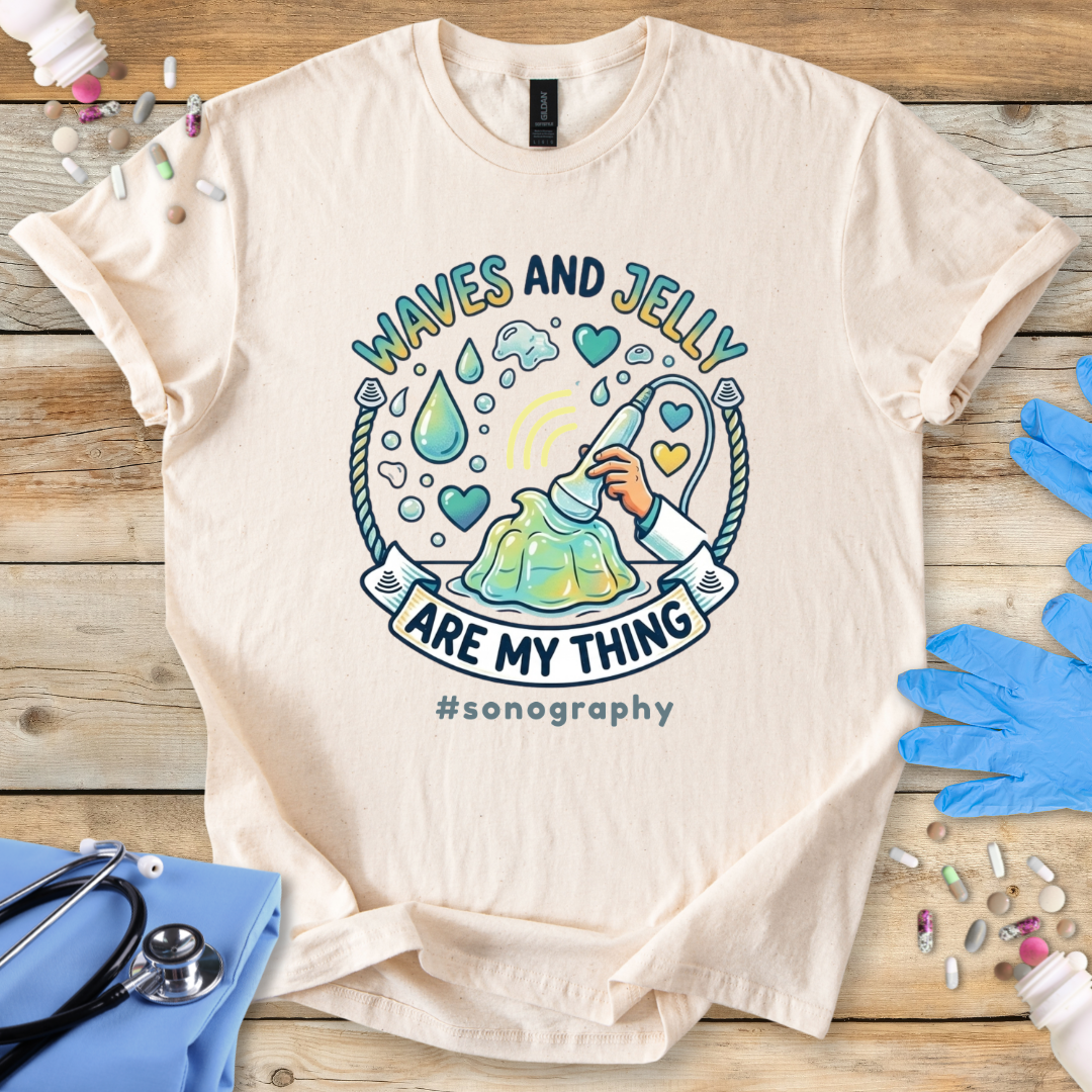 Natural t-shirt with 'Waves and Jelly are my thing #sonography' design on a wooden surface with medical items.
