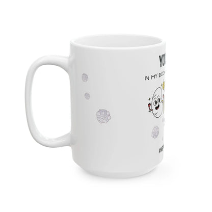 White mug with cartoon character and text on a white background