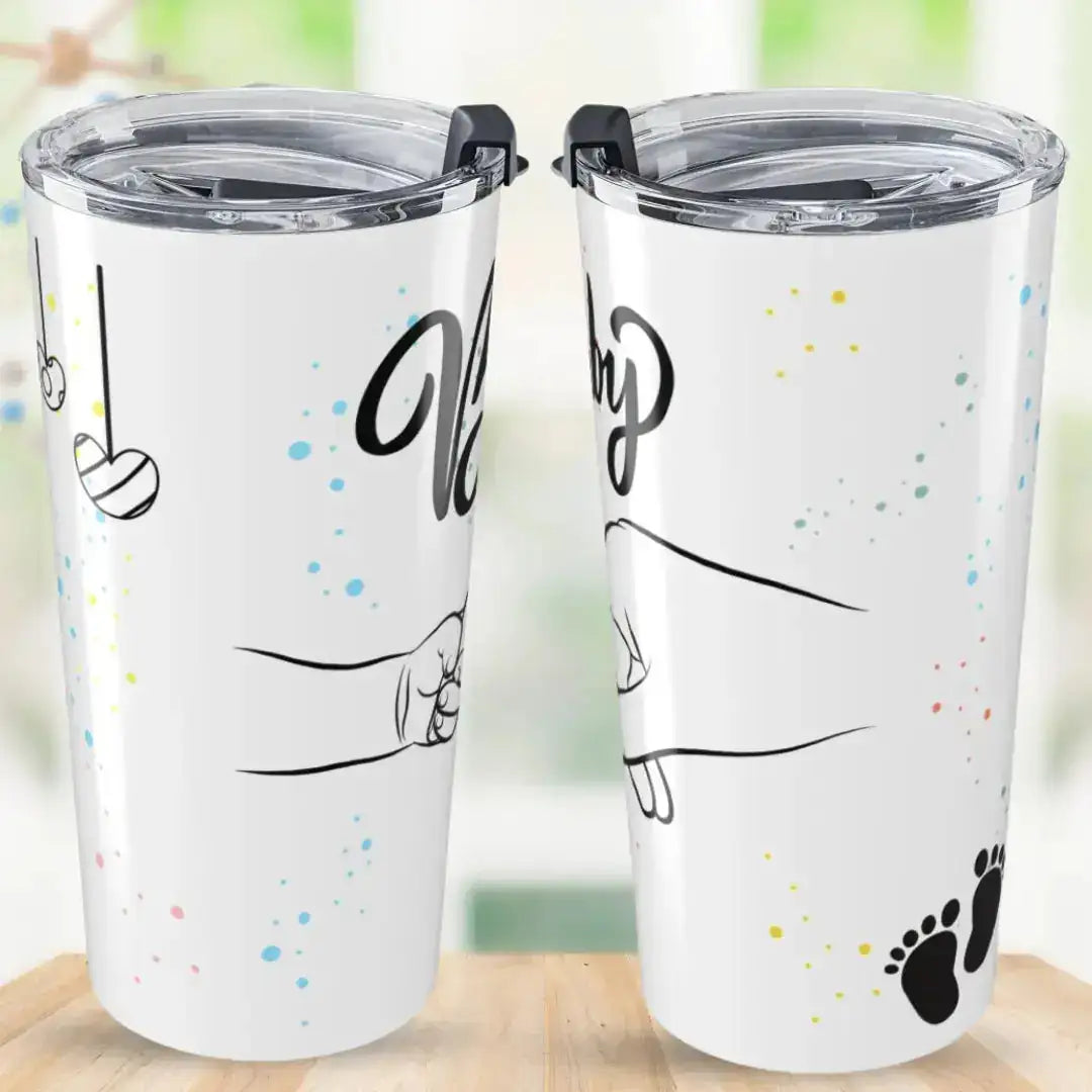 Two tumblers with illustrations of a 'babys hand held' on a wooden surface.