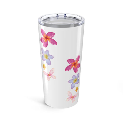 White tumbler with colorful floral designs on a white background