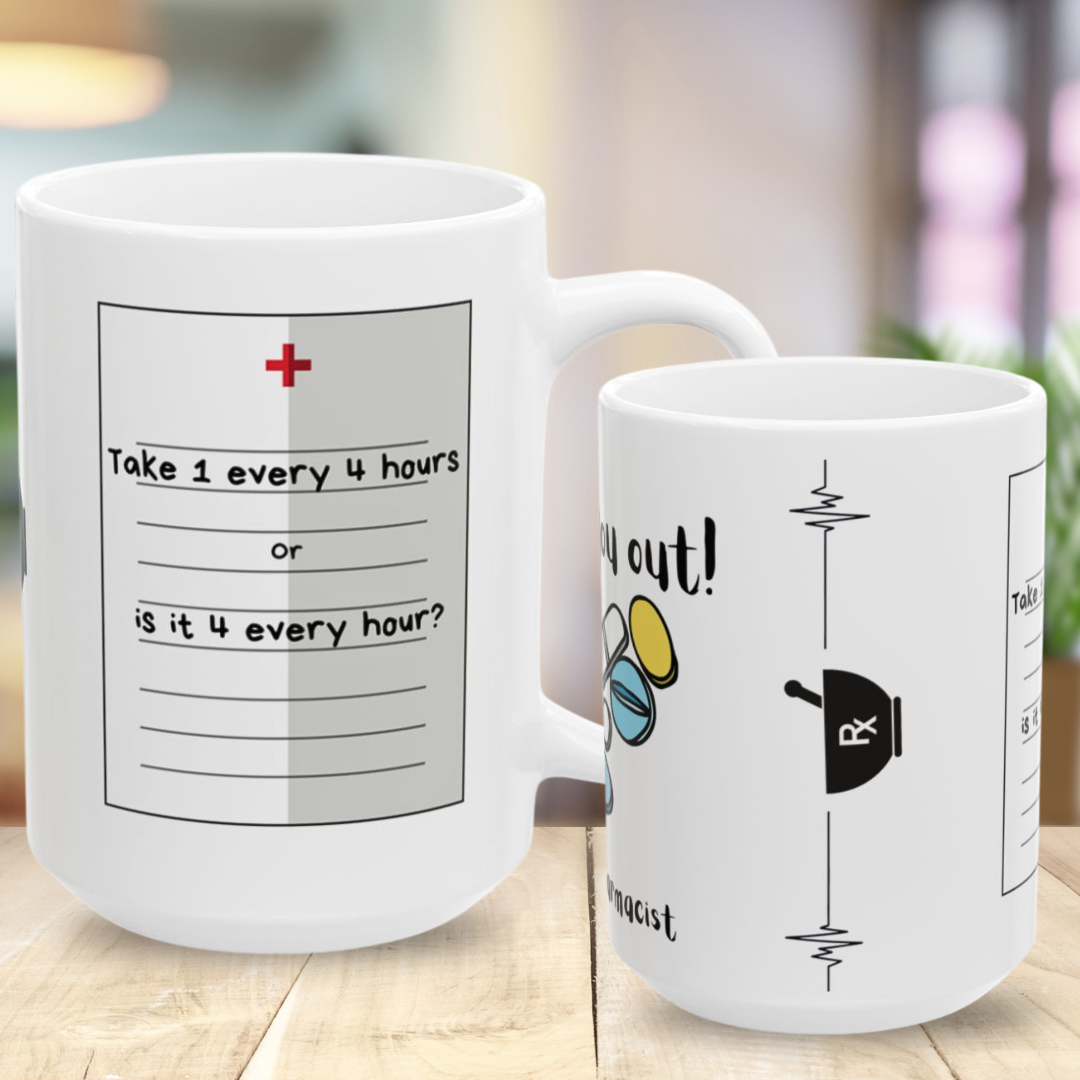 Two white mugs with pharmacy humor text and medical graphics on a wooden surface.