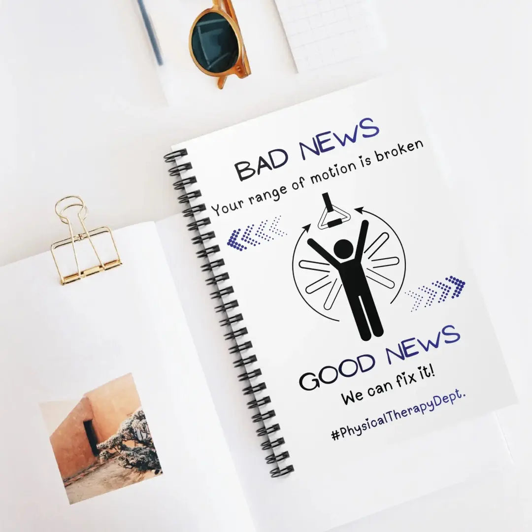 Notebook with a humorous message about physical therapy on a white surface.