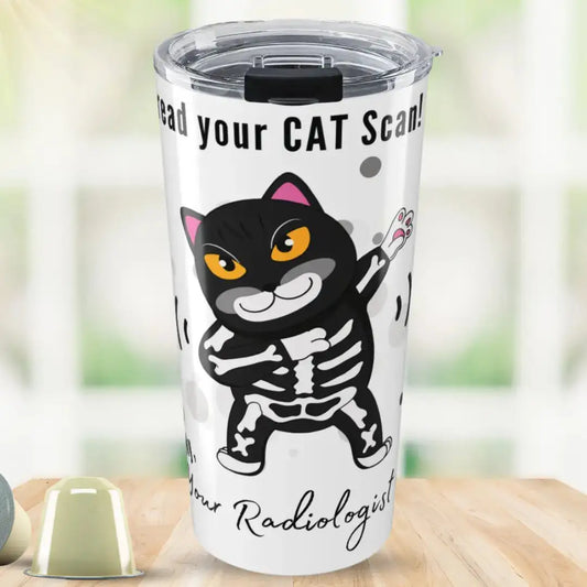 White stainless steel tumbler with 'I Can Read Your CAT Scan! Sincerely, Your Radiologist' text and a bold dabbing black cat in a skeleton costume with sound wave graphics, on a blurred green background.