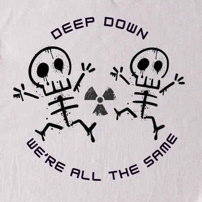 Gray t-shirt with black skeletons original design and text 'Deep Down We're All The Same' on a Gray background.
