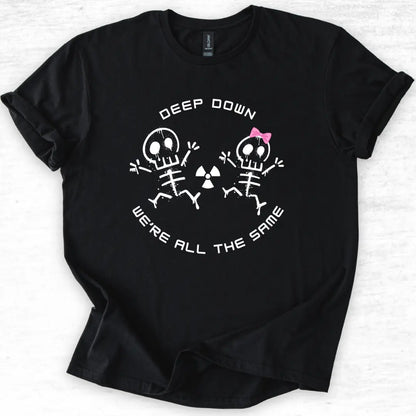 Black t-shirt with skeleton design and 'Deep Down We Are All The Same' text on a light gray background