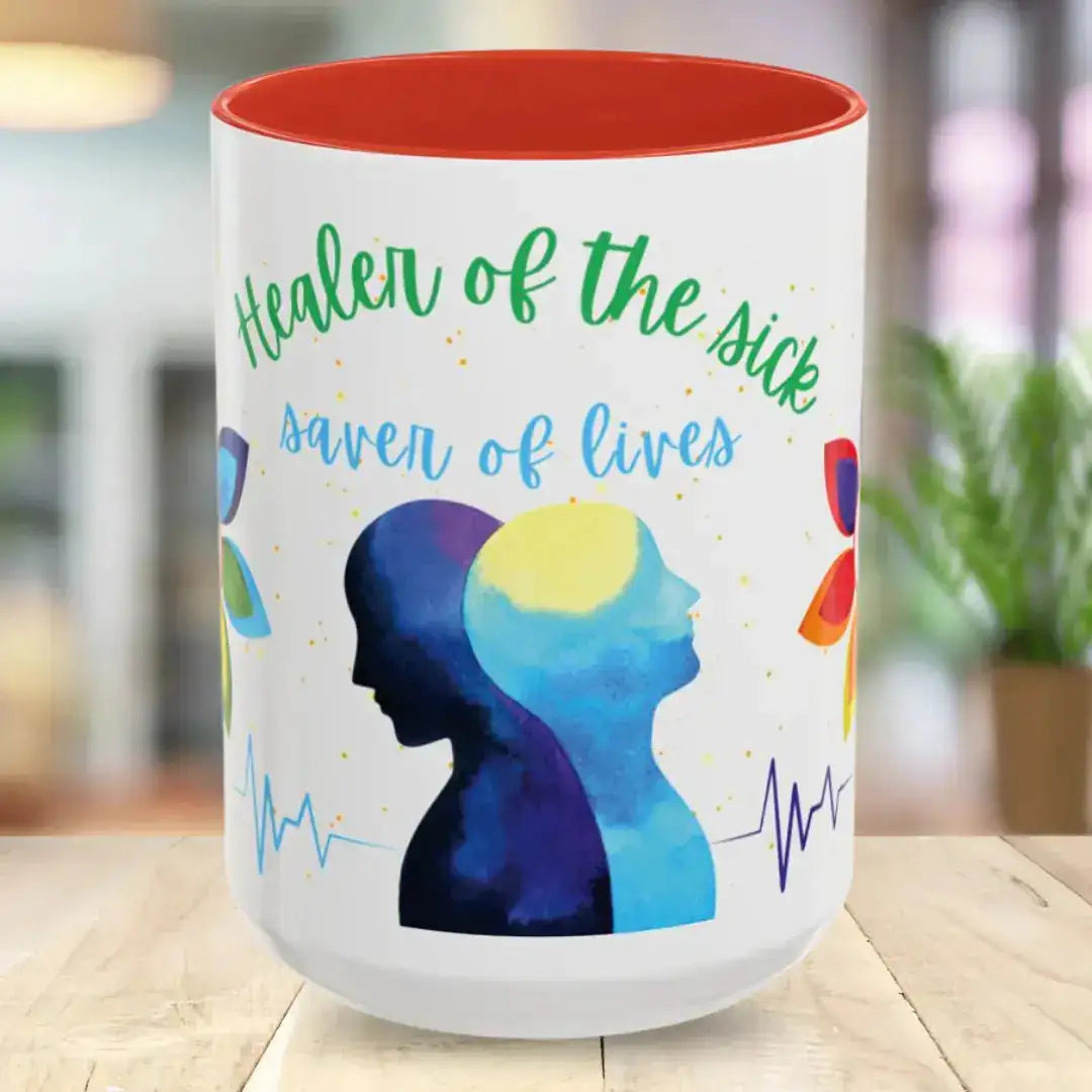 Mug with colorful design and 'Healer of the sick saver of lives' text on a wooden surface