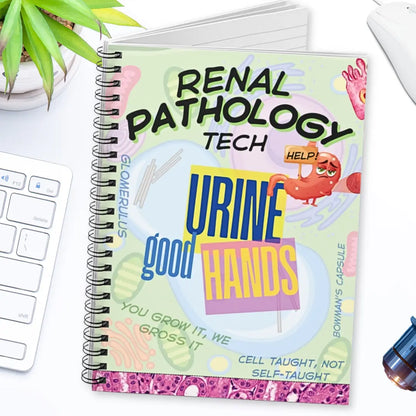 Notebook titled 'Renal Pathology Tech' with colorful text and graphics on a desk.