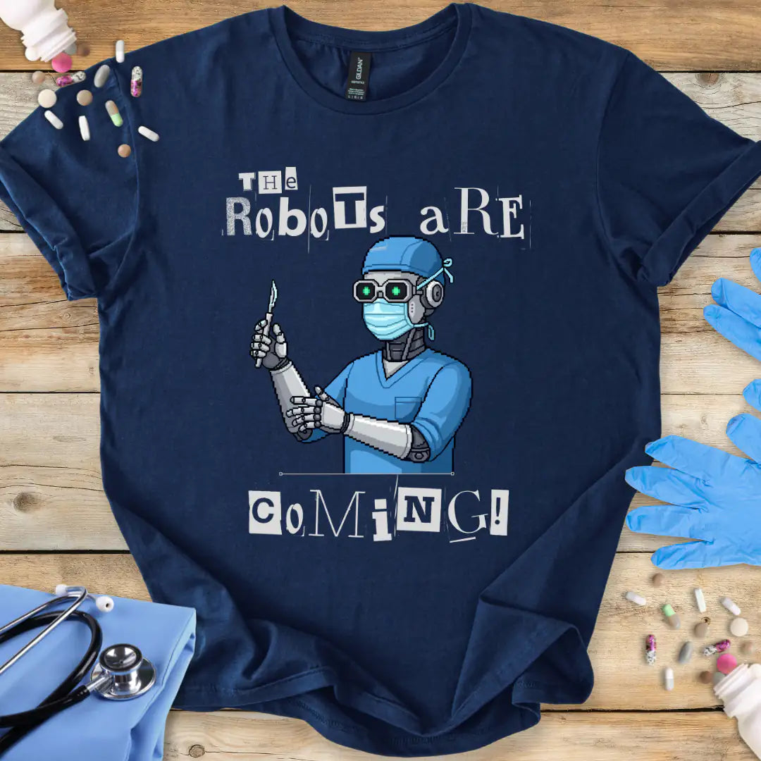 Navy blue t-shirt with a robot doctor graphic and 'The Robots Are Coming' text on a wooden surface with medical-themed props.