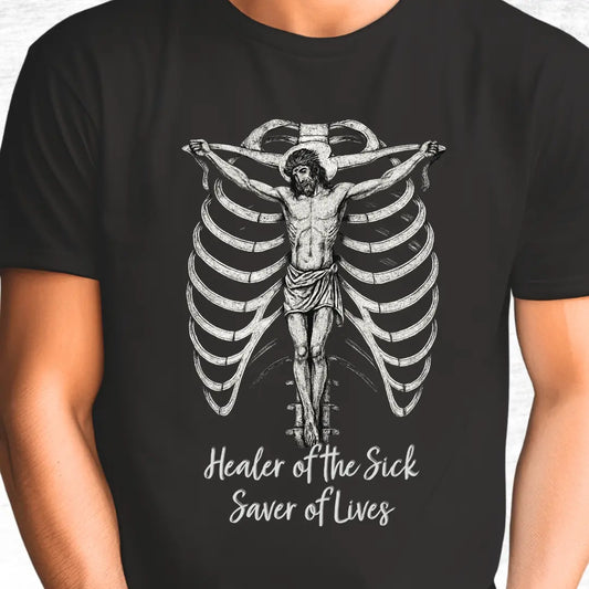 Black t-shirt with a graphic of Jesus and text 'Healer of the Sick, Saver of Lives' text on a white background.