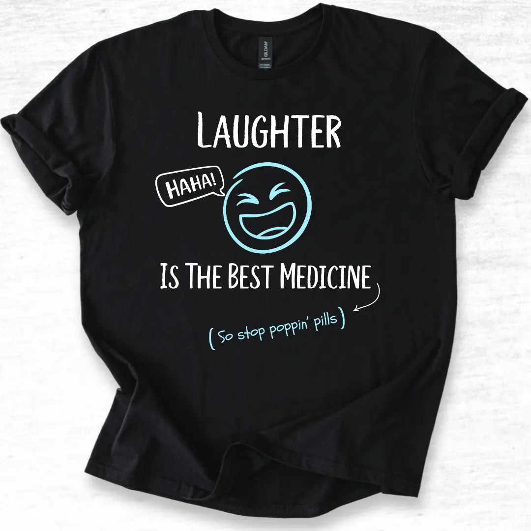 Black funny medical t-shirt with humorous text 'Laughter is the best medicine so stop poppin pills' and original laughing design on a white background.