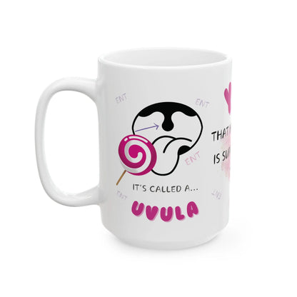 White mug with a graphic of a tongue and lollipop and 'It's Called A Uvula' text on a white background