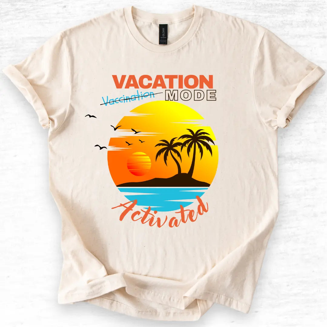 Beige t-shirt with 'Vacation Mode Activated' graphic design featuring a sunset and palm trees on a white background.