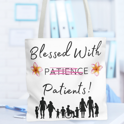 Tote bag with 'Blessed With Patience Patients!' text and family illustrations on a blurred background.